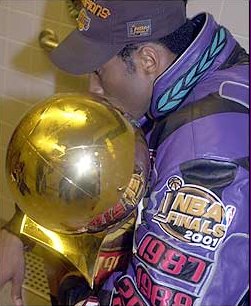 Kobe Kisses The Championship Trophy