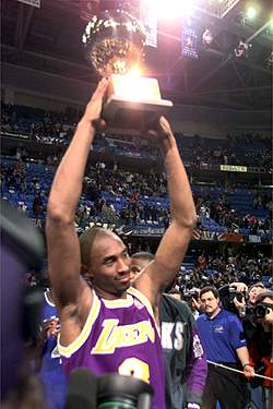 Kobe Holds The Slam Dunk Trophy