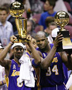 Kobe And Shaq Hold Their Trophies
